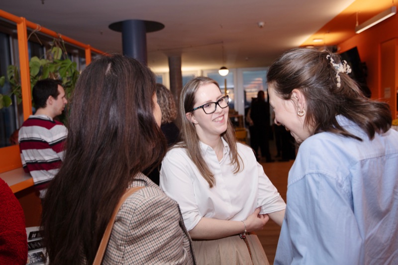 Attendees talking one-on-one at a networking event